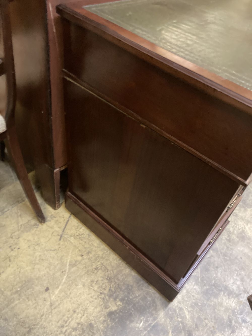 A late Victorian mahogany pedestal desk, stamped J. Shoolbred, width 122cm depth 55cm height 75cm